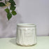 White ceramic pot with &