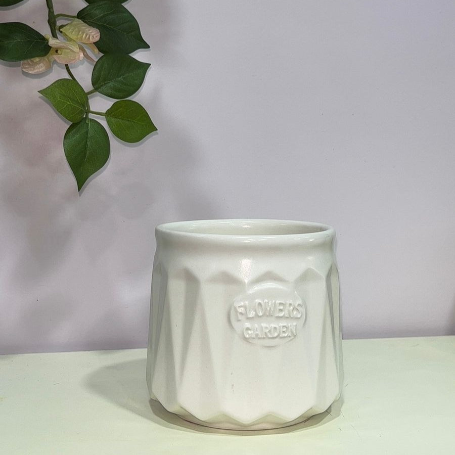 White ceramic pot with &