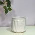 White ceramic pot with &
