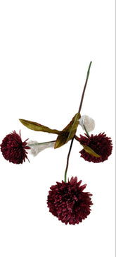 Artificial flower arrangement with red flowers and green leaves on a white background