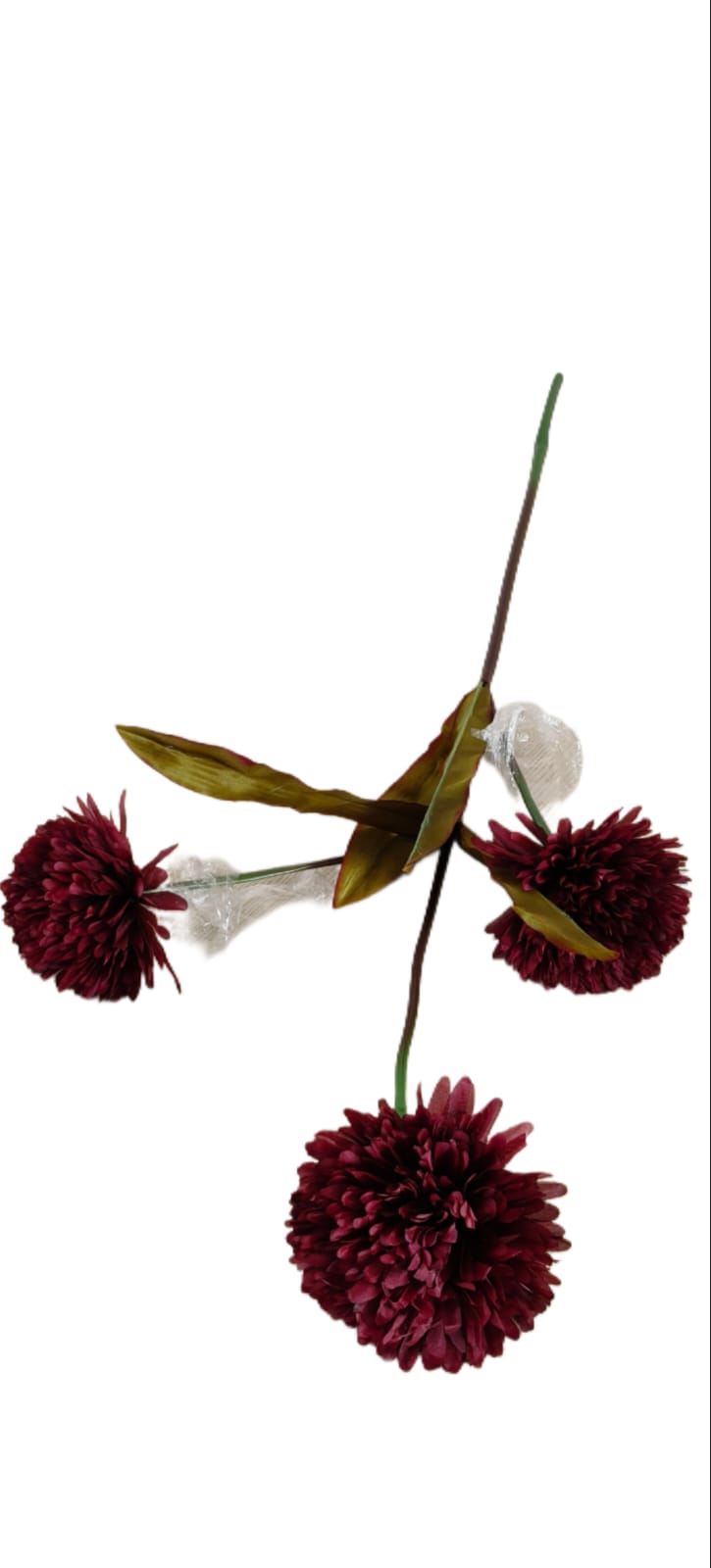 Artificial flower arrangement with red flowers and green leaves on a white background