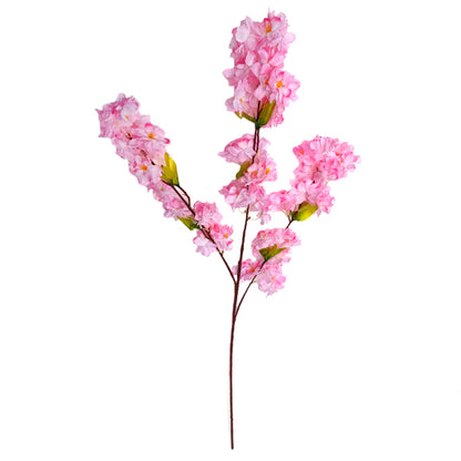 Artificial pink cherry blossom branch on a white background