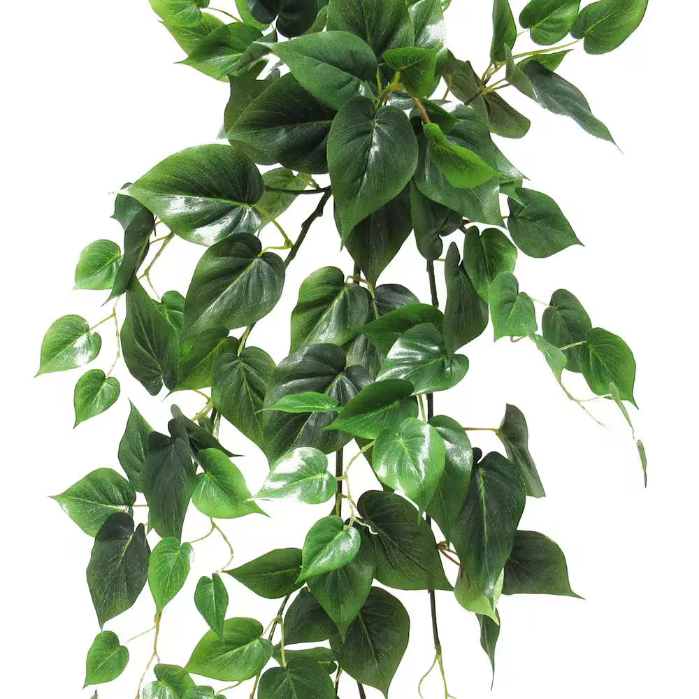 Artificial green leaves on a white background