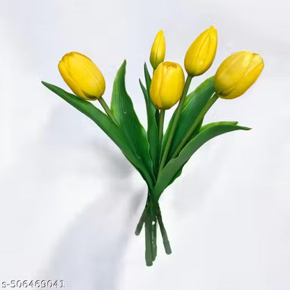 Bouquet of yellow tulips on a light gray background